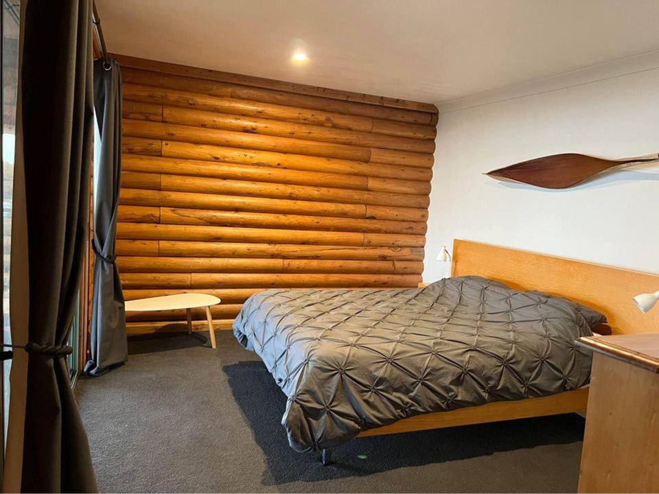 Master bedroom with queen bed and lake view